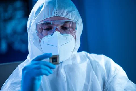 Microelectronics engineer works in a modern scientific laboratory on computing Stock Photos