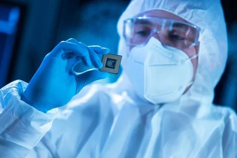 Microelectronics engineer works in a modern scientific laboratory on computing Stock Photos
