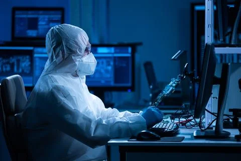 Microelectronics engineer works in a modern scientific laboratory on computing Stock Photos