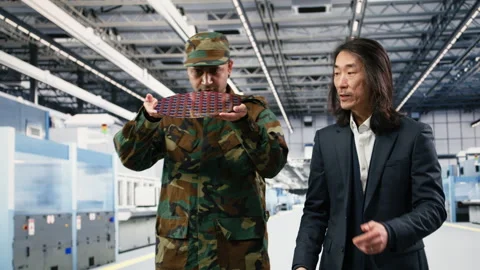 Microelectronics production factory manager and soldier brainstorm Stock Footage 333395300