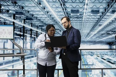 Microelectronics smart factory directors use EDA software to optimize production Stock Photos