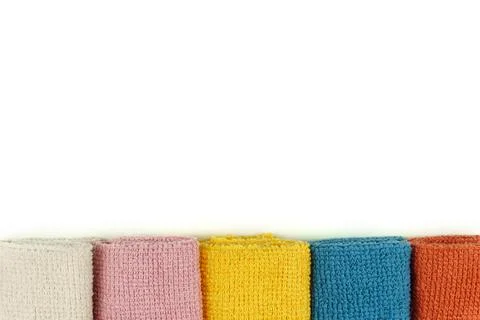 Microfiber cleaning cloth. Isolated.Colored microfiber cloths, lying in a row. Stock Photos