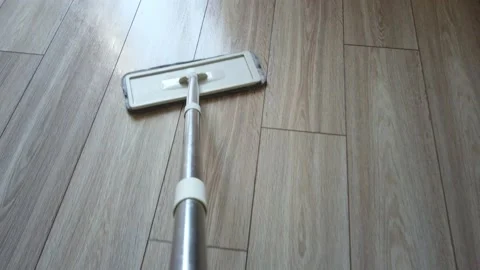 Microfiber Dust Wet Mop move around the floor close-up. Top view POV of mop in Stock Footage 148721964