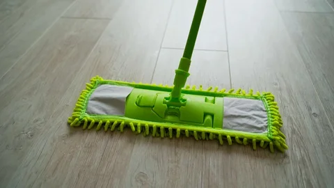 Microfiber wet mop moving around the floor at home.  Stock Footage 130016622