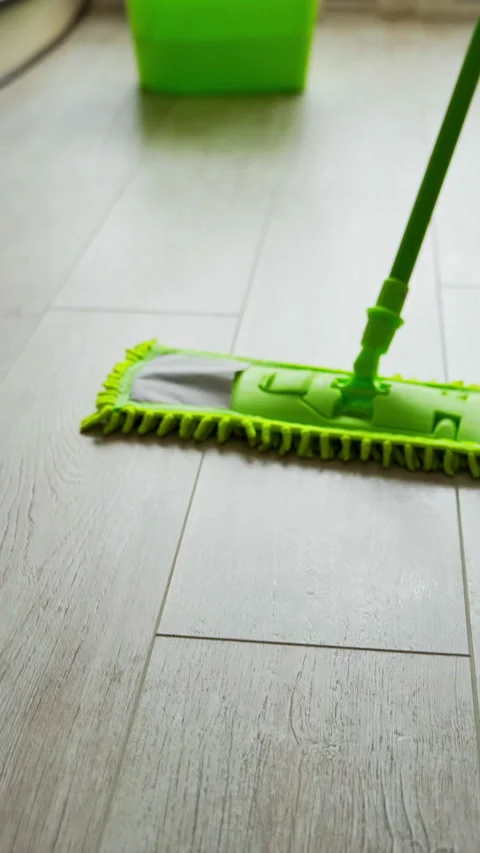 Microfiber wet mop moving around the floor at home.  Stock Footage 272174717