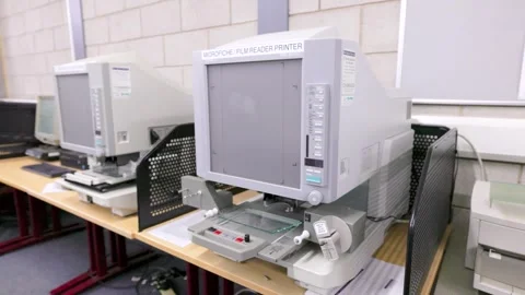 Microfiche reader inside a library 스톡 동영상 244878642