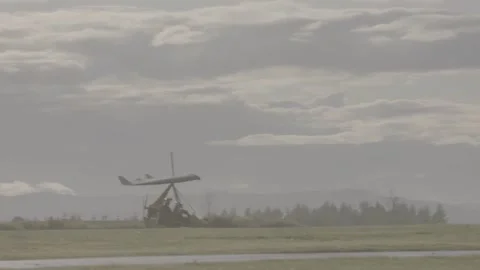 Microlight preparing for take off and in flight Stock Footage 147514053