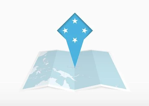 Micronesia is depicted on a folded paper map and pinned location marker wit.. Stock Illustration