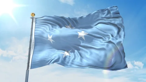 Micronesia flag waving in the wind against deep blue sky. National theme. Stock Footage 123984401