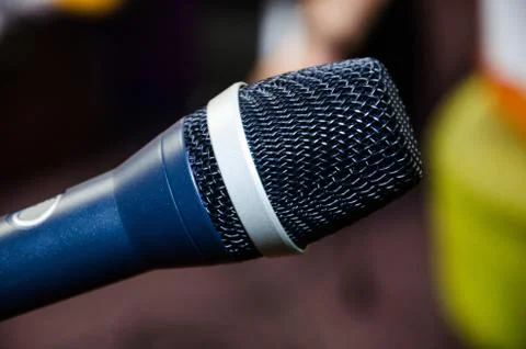 Microphone on abstract blurred of speech in seminar room or speaking conference Stock Photos