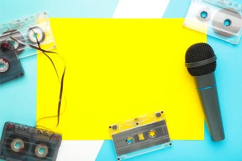 Microphone and cassette on blue background with copy space Stock Photos