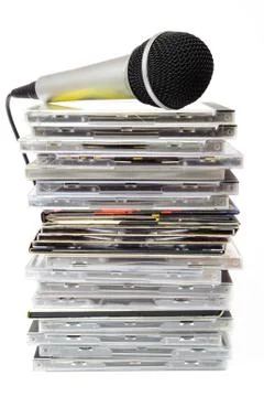 Microphone and karaoke compact discs collection Stock Photos