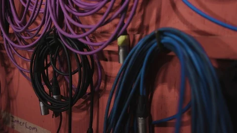 Microphone and power cable wall in a studio or audio recording studio Stock Footage 89497790