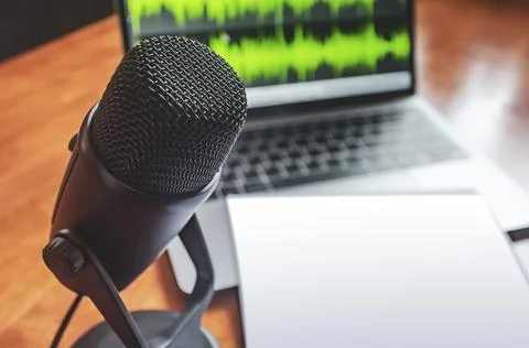 Microphone and wave form on the screen and blank sheet 스톡 사진