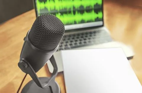 Microphone and wave form on the screen and blank sheet Fotos de archivo
