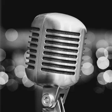 Microphone on a background of blue lights Stock Photos