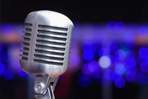 Microphone on a background of blue lights Stock Photos