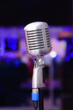Microphone on a background of blue lights Stock Photos