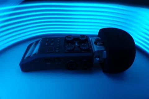 Microphone background of multicolored neon rays Stock Photos