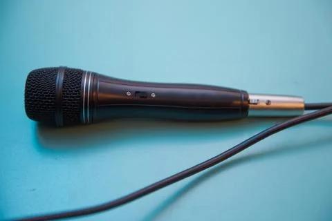 Microphone in the blue background . A microphone isolated on a sky background Stock Photos