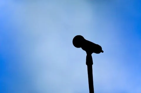 Microphone on blue Stock Illustration