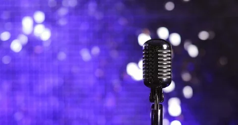 Microphone on blue shiny background on stage in nightclub. Stock Footage 123234560