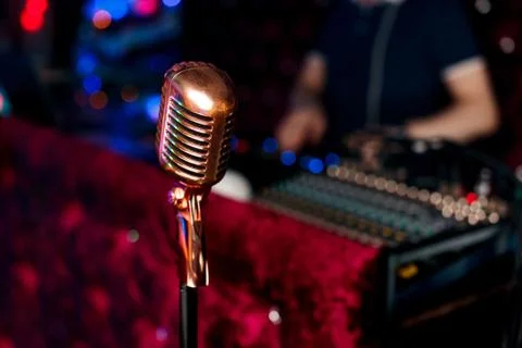 Microphone on a blurred background. Stock Photos