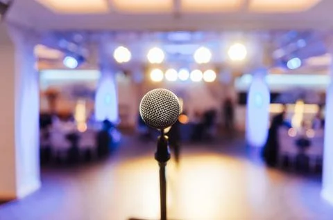 Microphone on blurred of speech in seminar room Stock Photos