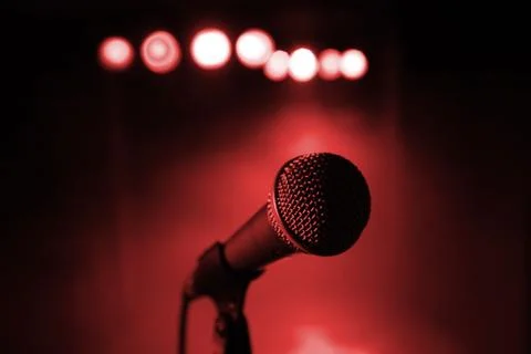 Microphone close up with red light on background Stock Photos