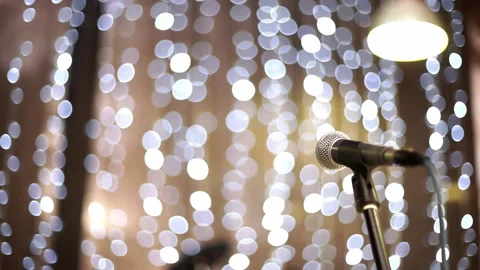 Microphone in concert hall with lights in background. Stock Footage 159369653