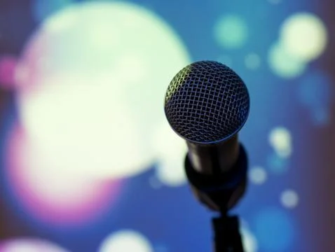 Microphone with disco lights at background Stock-Fotos