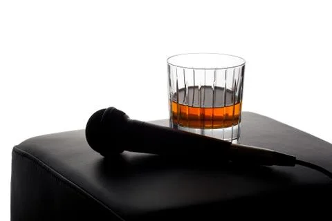 Microphone on an empty stool Stock Photos