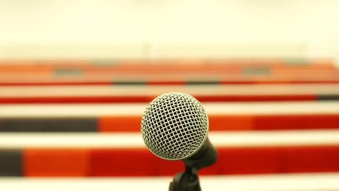 Microphone in an empty University or College Lecture Hall Classroom seats. Video stock 128514067