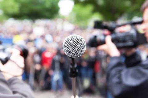 Microphone in focus at street protest Stock Photos