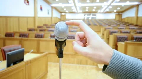 Microphone in hall and a hand which taps on it close up Stock Footage 10681723