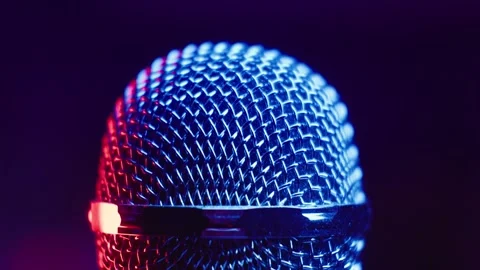 Microphone head rotating with blue and red light. Concert microphone Stock Footage 263682103
