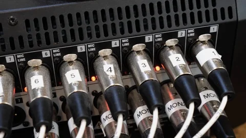 Microphone input jacks on an audio mixing panel Stock Footage 125784896