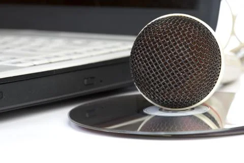 The microphone lays on notebook Stock Photos