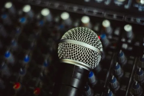 The microphone lies on the mixer Stock Photos