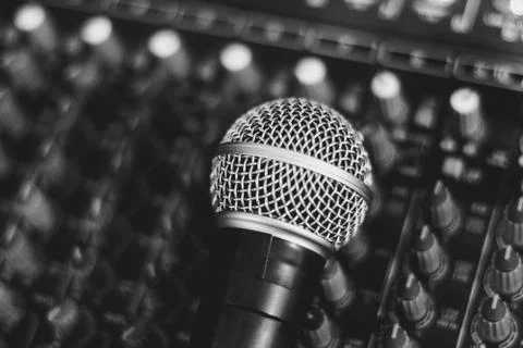 The microphone lies on the mixer Stock Photos