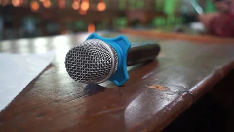 The microphone lies on the table after the presentation is used Stock Footage 237054645