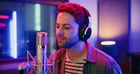 Microphone, man and singer in music booth with headphones for recording song Stock Footage 332322744