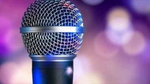 Microphone moving on blurred bokeh circles background Video stock 115492608