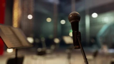 A microphone that is next to a sheet music Stock Illustration