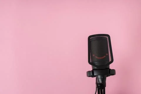 Microphone on a pink background with space for text. Stock Photos