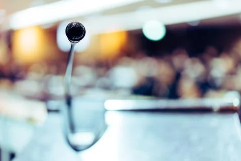 Microphone placed on a stand in front of the room. Stock Photos