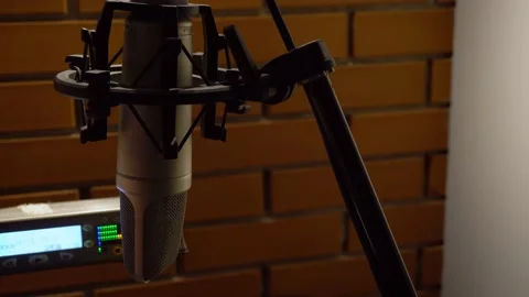 A microphone with recorder on a brick wall background in a recording studio. Stock Footage 135540391