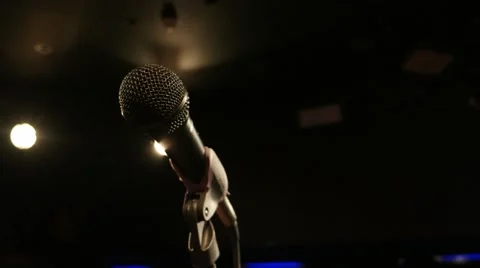 Microphone in a recording studio close-up illuminated floodlights 스톡 동영상 57765173