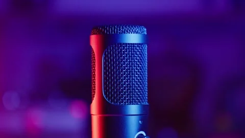 Microphone in red and blue lights rotating at dark background. Stock Footage 263701067