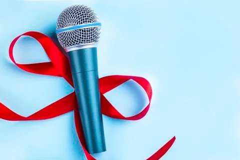 Microphone with red bow Stock Photos